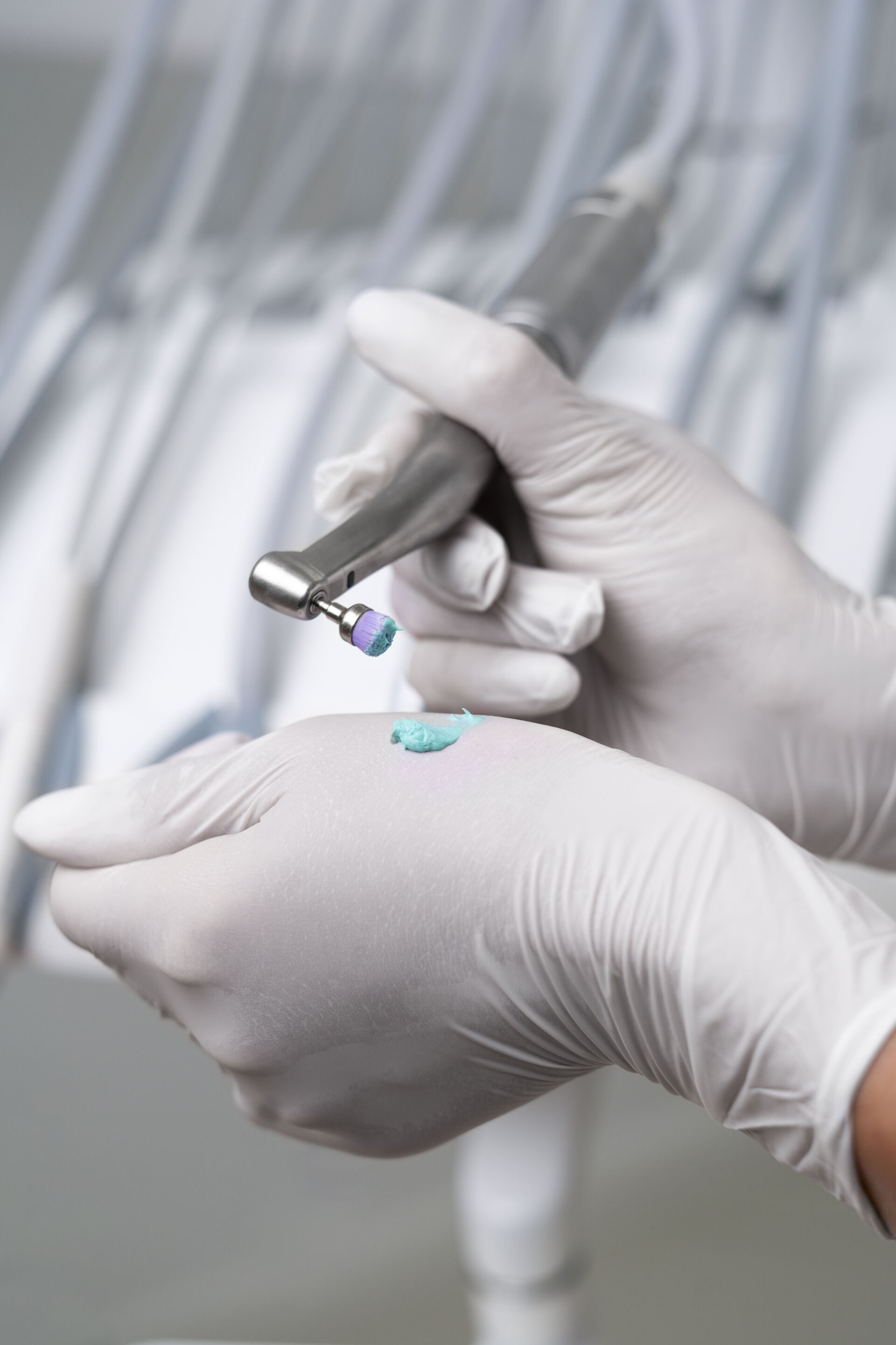 Close up of Patient First dentist preparing to clean patients teeth