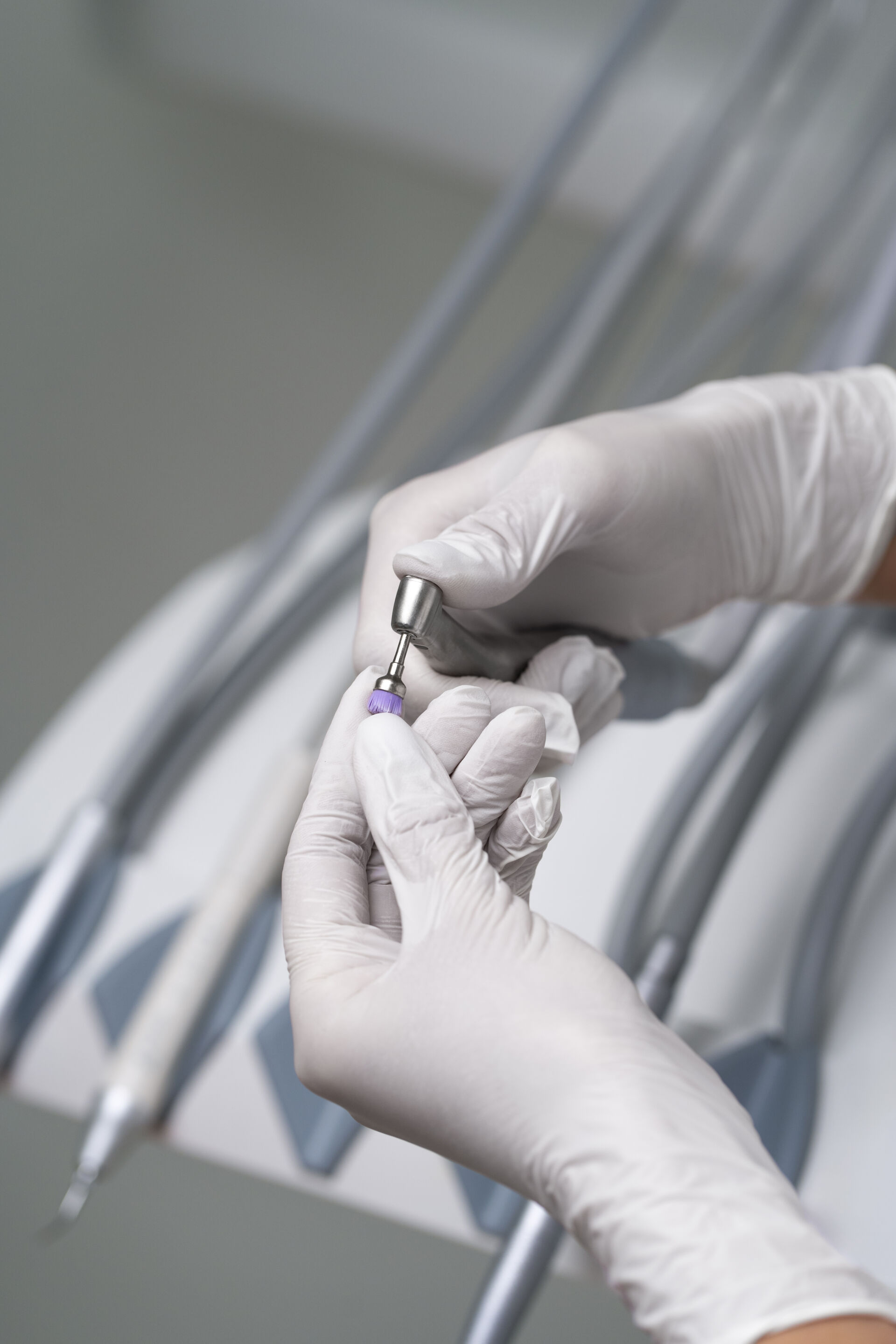 Patient First Dentist holding oral hygiene equipment