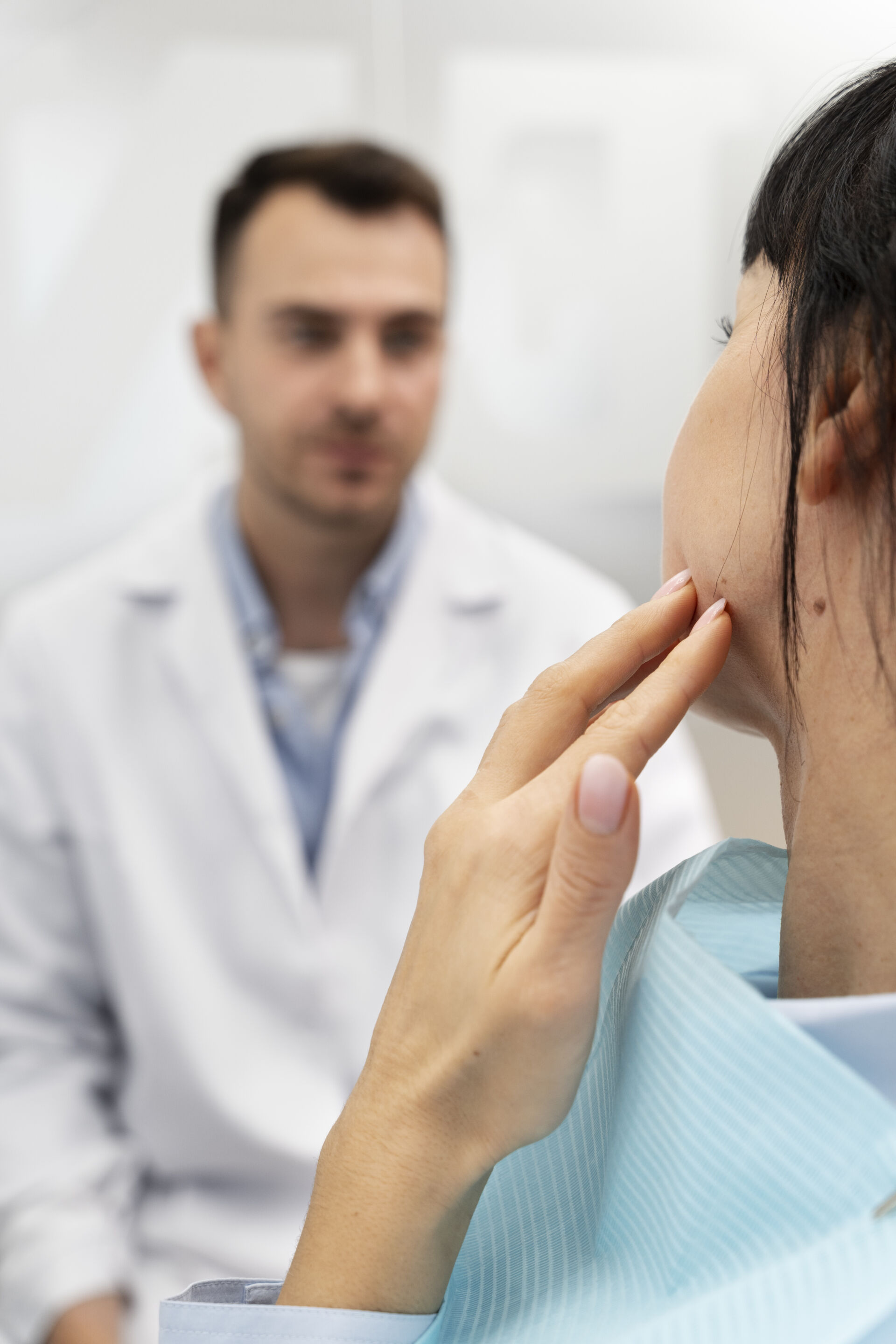 Patient First - Patient explaining where they are having pain to dentist