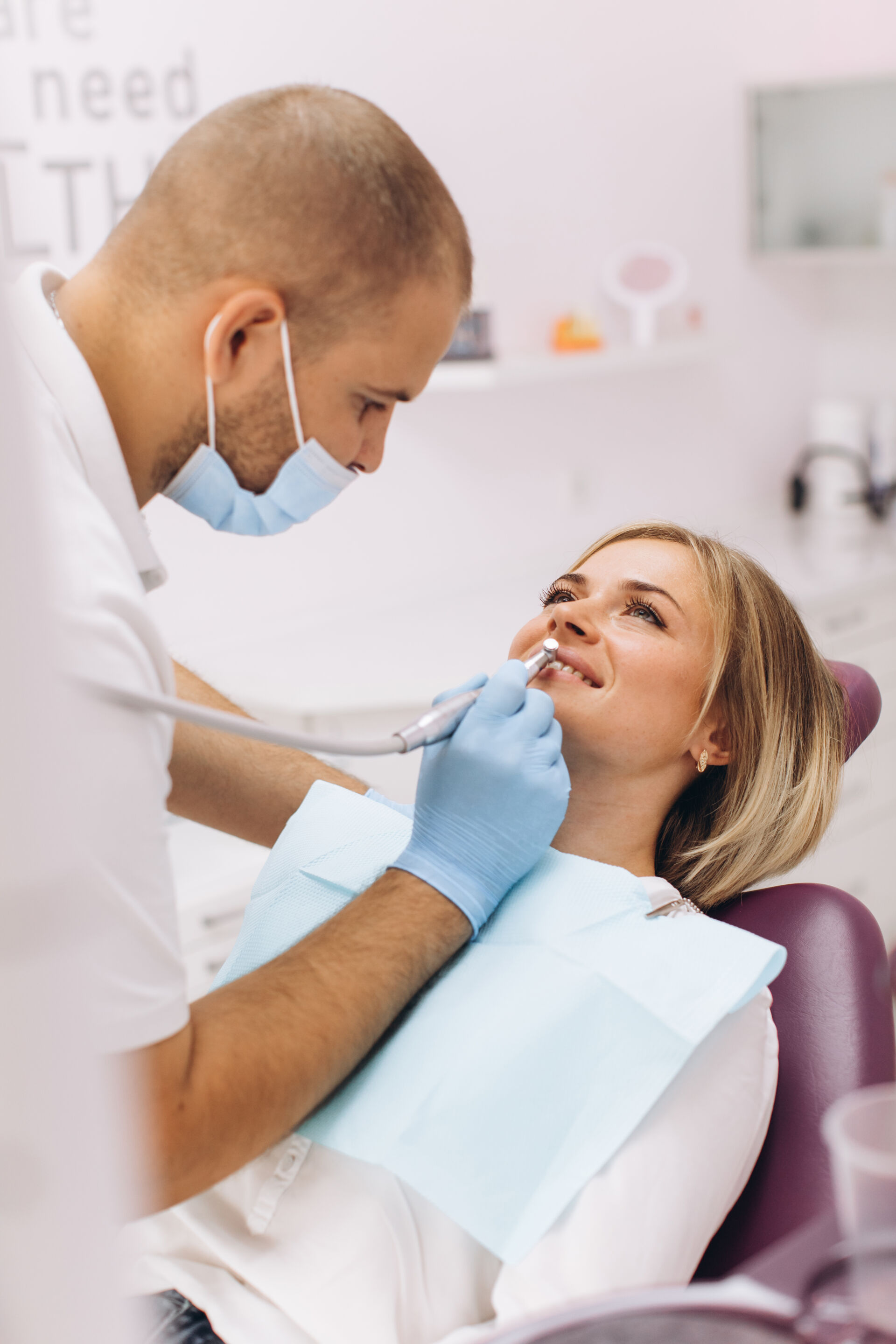 Patient First Dentists treating a woman's teeth