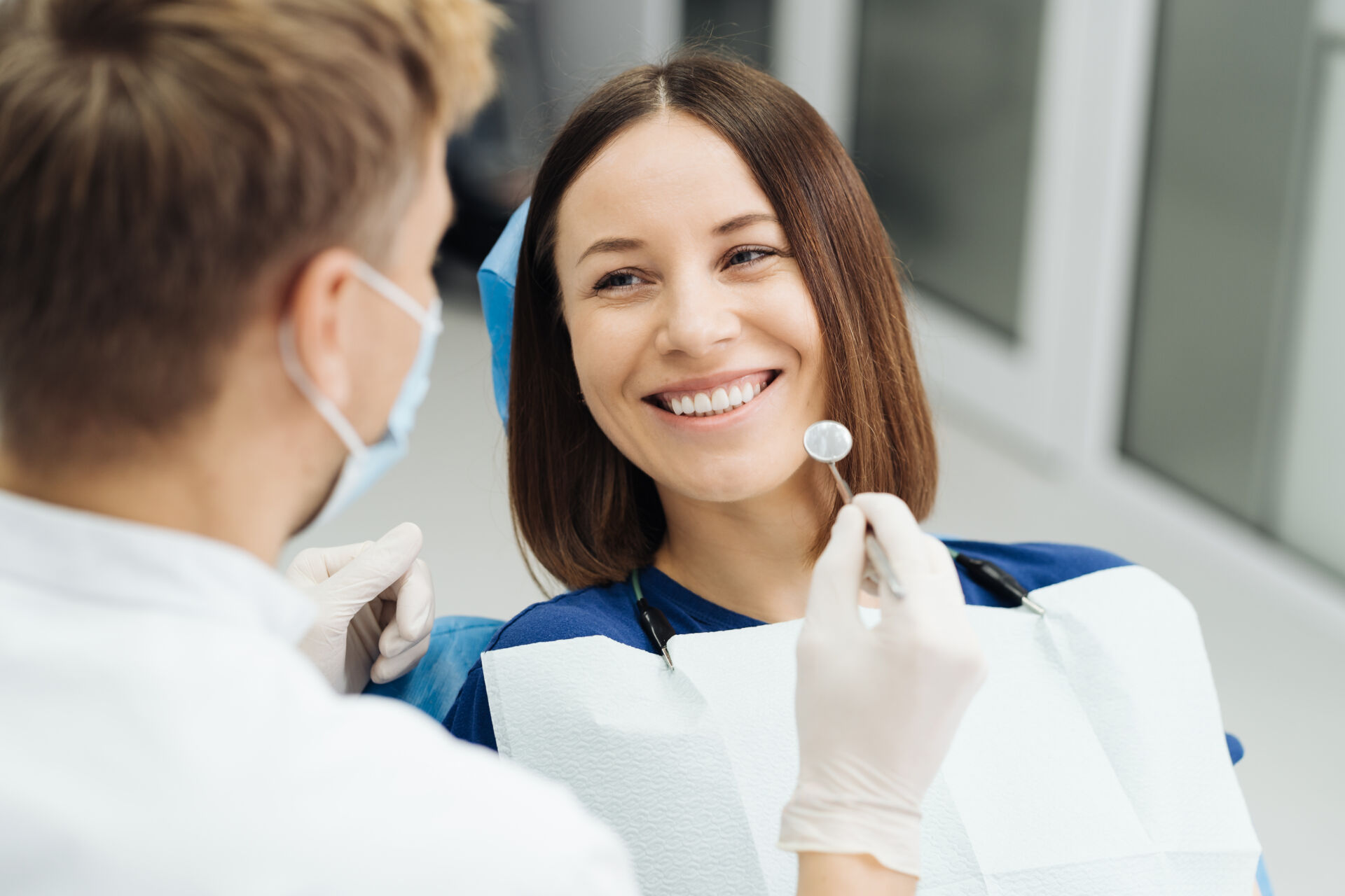 Patient First - Dentist discussing with patient what their teeth will look like after the procedure