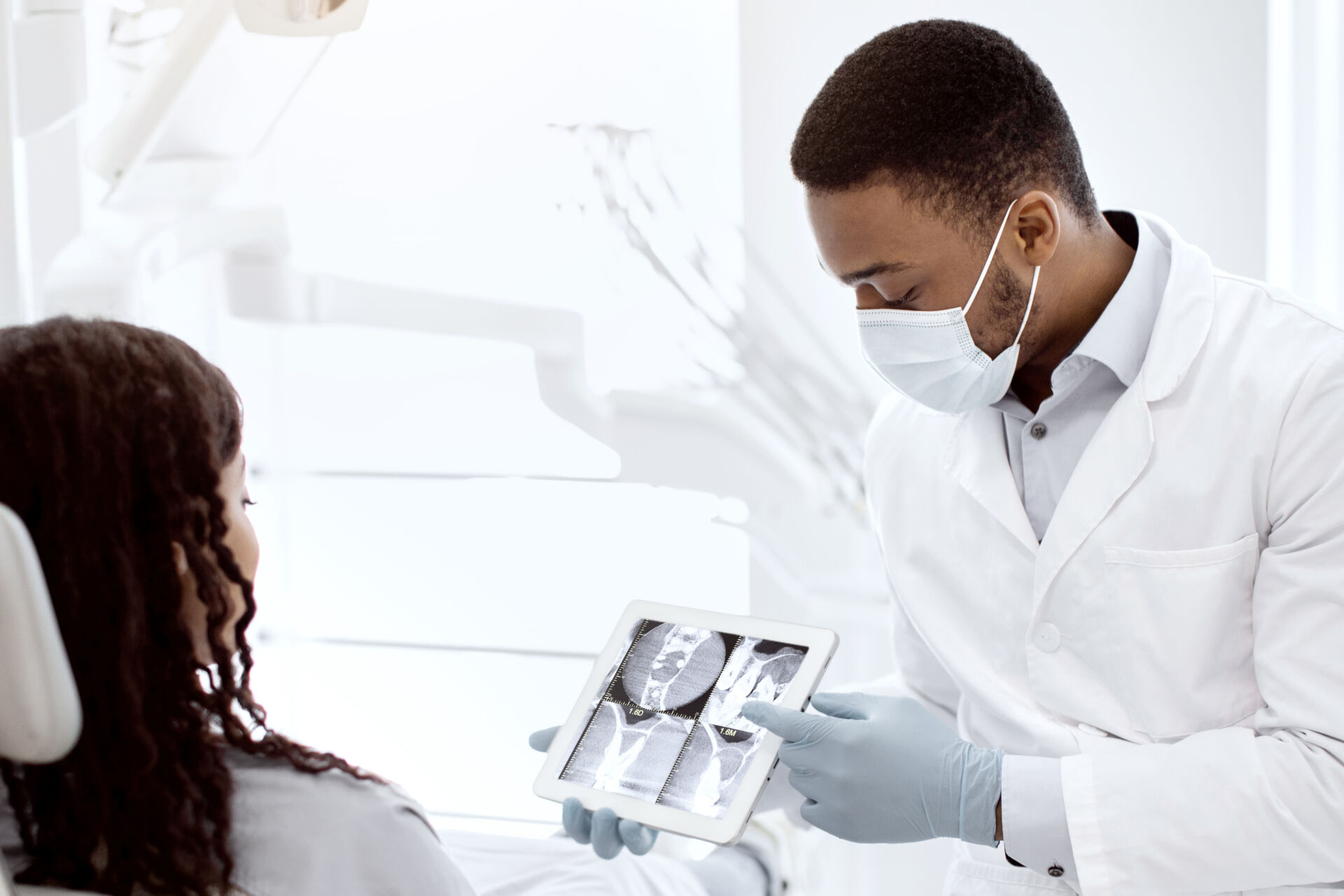 Patient First Dentist showing patient an X-Ray of their teeth